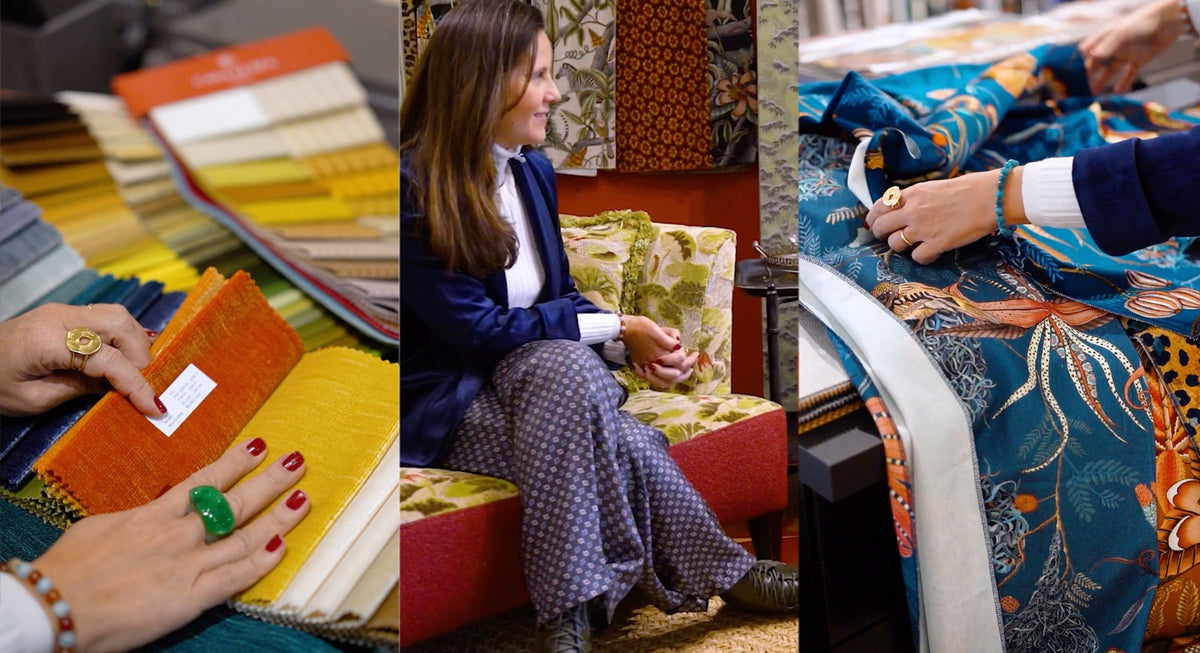 Luiza Marra reviewing fabric samples and sitting amongst fabrics and home furnishings